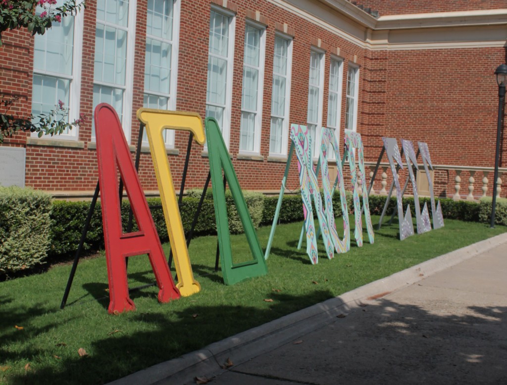 Colorful and decorated Greek life organization letters stand proud in front of Hubbard Hall. (Photo by Chuck Greenslade)