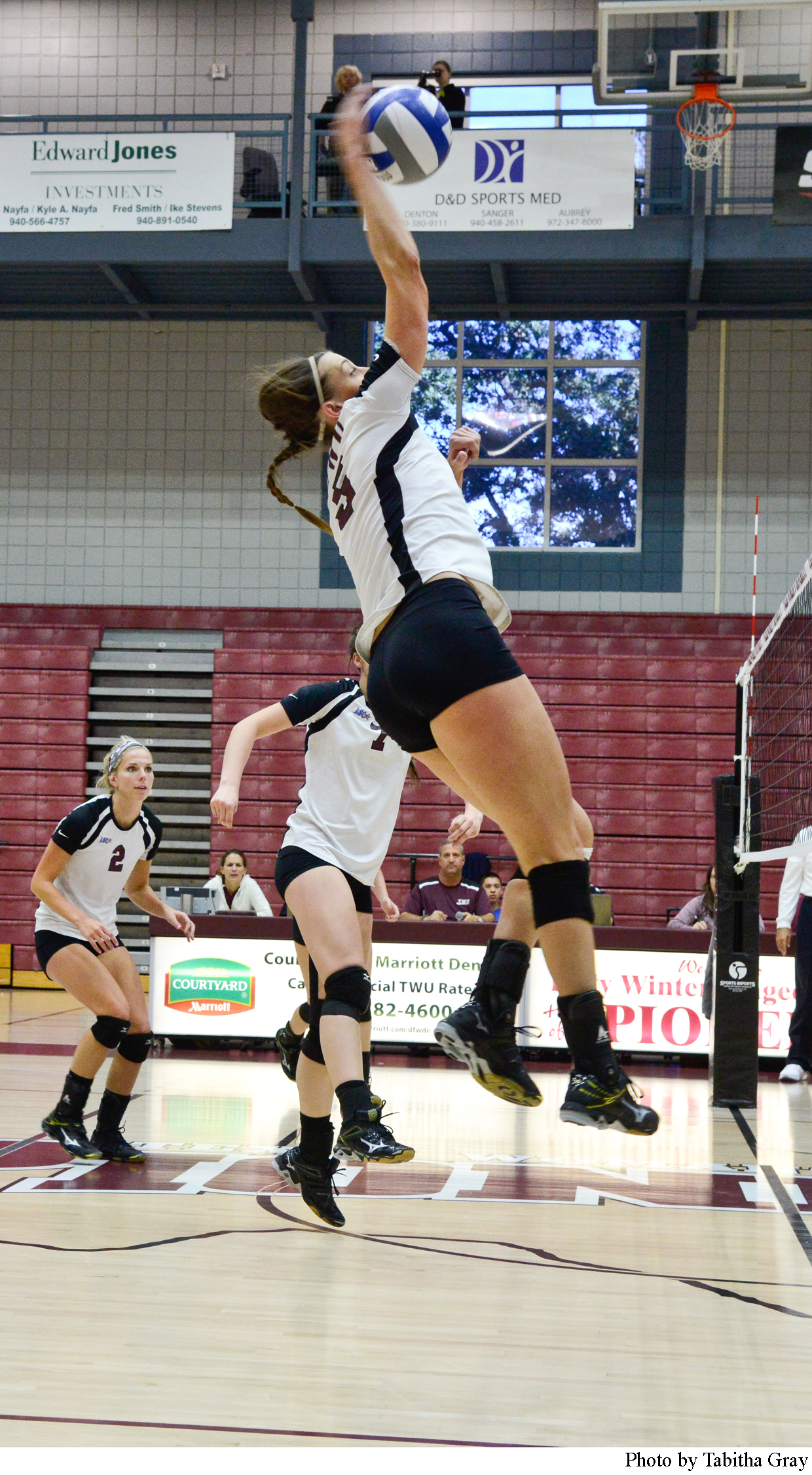 Middle Blocker Sara Oxford #5 makes an effort to spike the ball in the game against Midwestern State.
