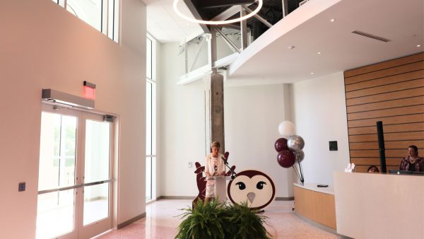 Chancellor Feyten stands behind a podium in the new Brackenridge welcome center