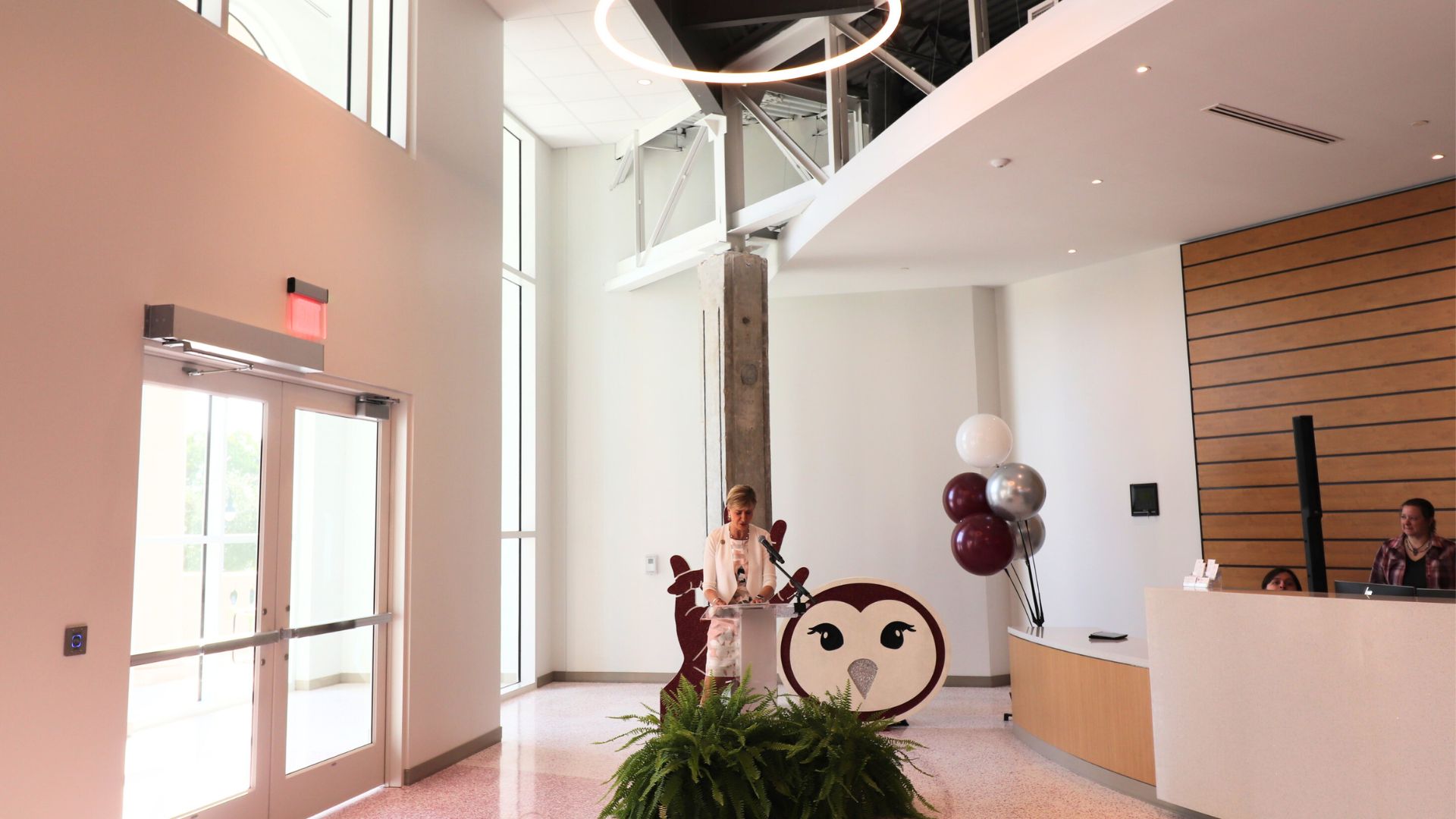 Chancellor Feyten stands behind a podium in the new Brackenridge welcome center