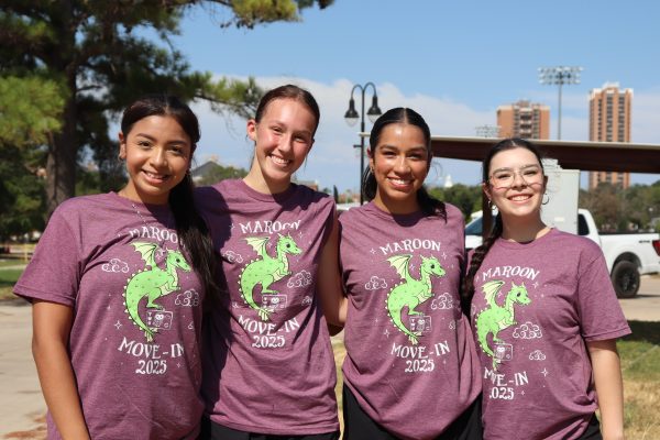 Group of 4 girls in matching volunteer shirts