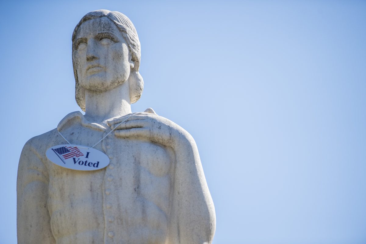 Statue with "I Voted" sticker on it